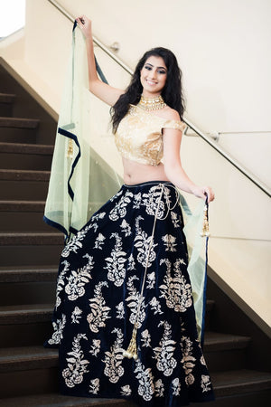 Hand embroidered deep blue lehenga with off shoulder choli and deep navy blue bordered dupatta
